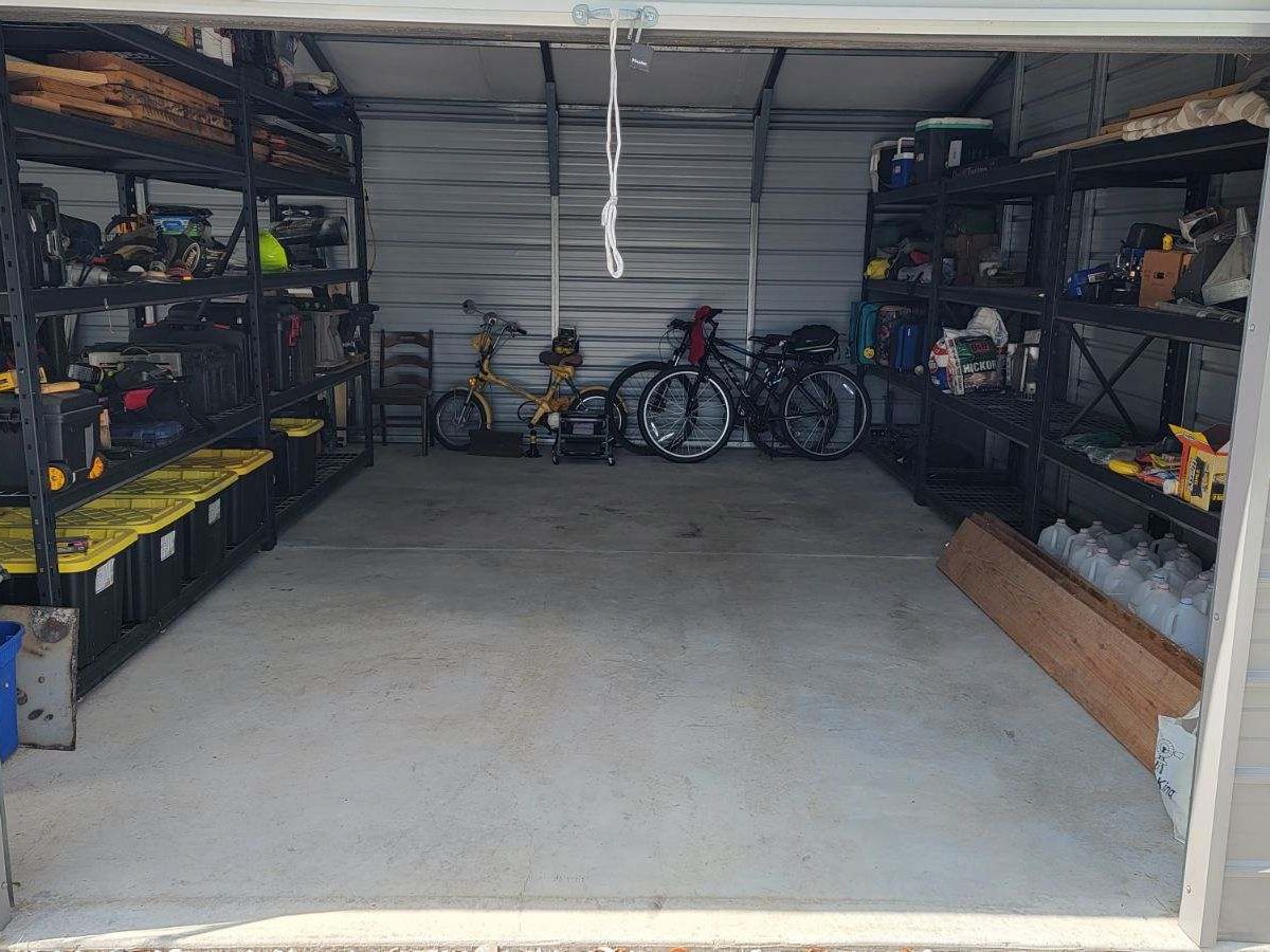 The same garage with clear floor space and sorted shelving