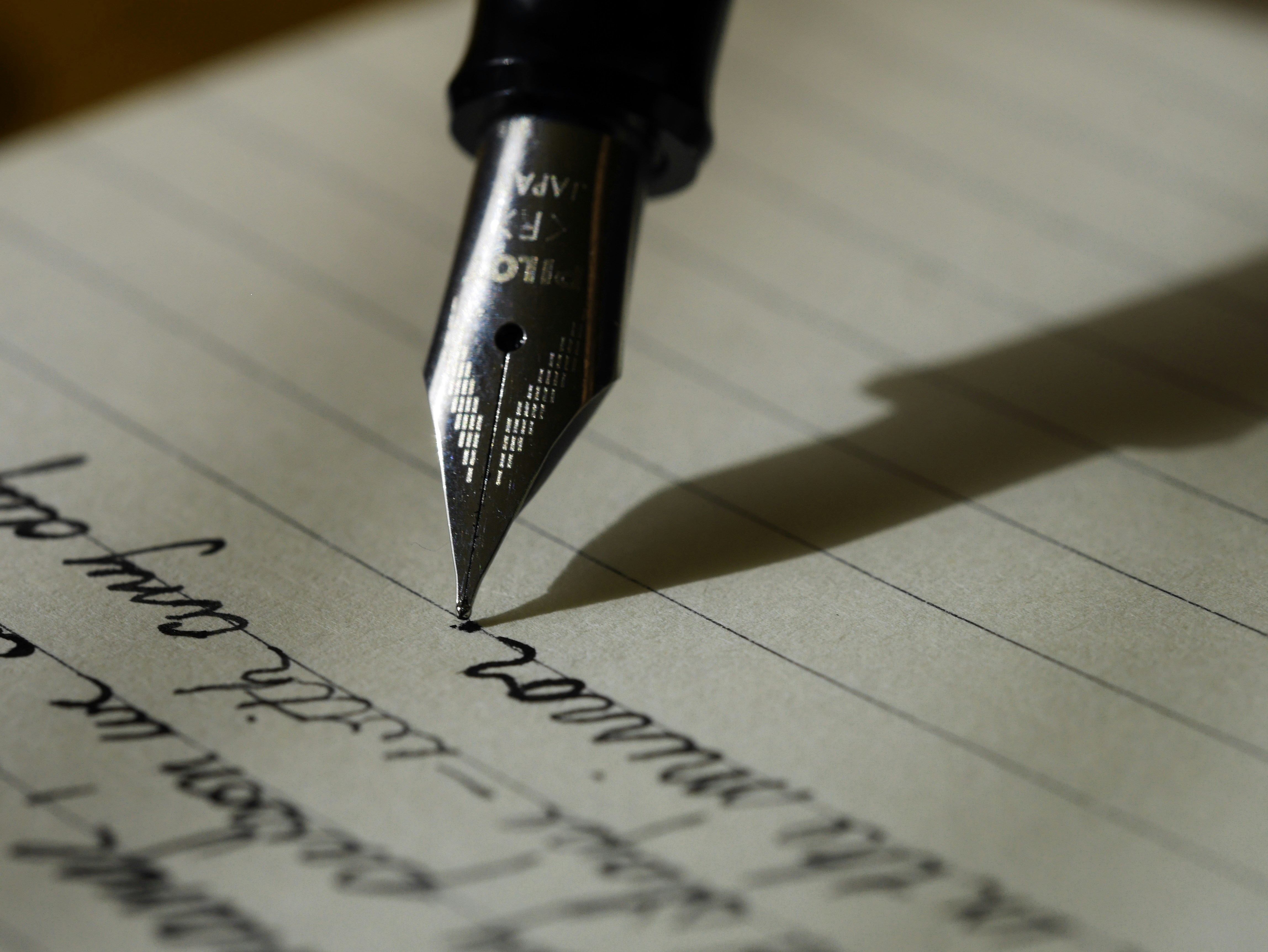 Handwritten letters and a fountain pen
