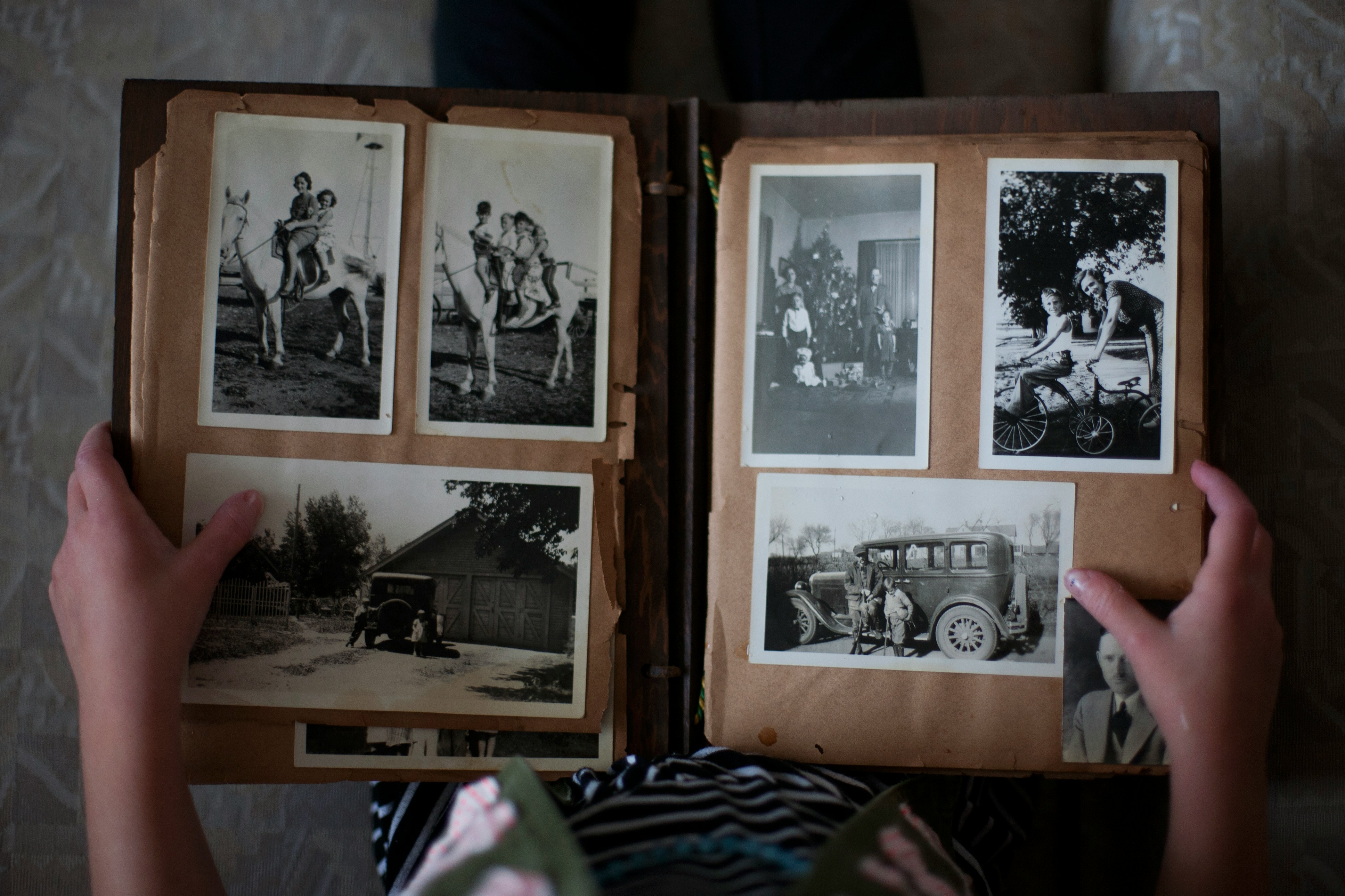 Loose photographs spread across a table